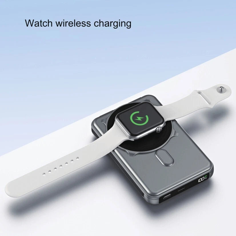 Wireless charging pad with a smartwatch on a light blue background