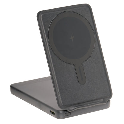 Black wireless charging stand on a white background