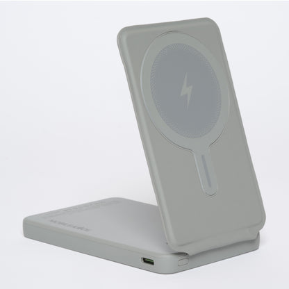 Gray wireless charging stand with a lightning bolt symbol on a white background