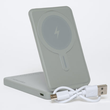 Gray wireless charging pad with a cable on a white background