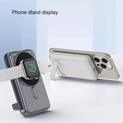 Phone stand displaying a phone, smartwatch, and wireless charger on a light blue background.